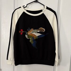 Women’s Black and White Sweater with Embroidered Bird Design